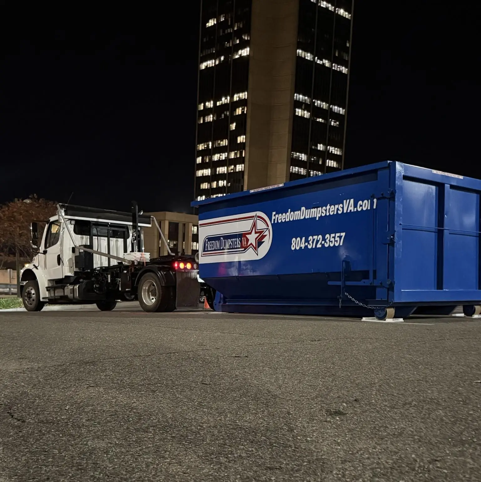 Freedom Dumpsters dumpster on residential driveway